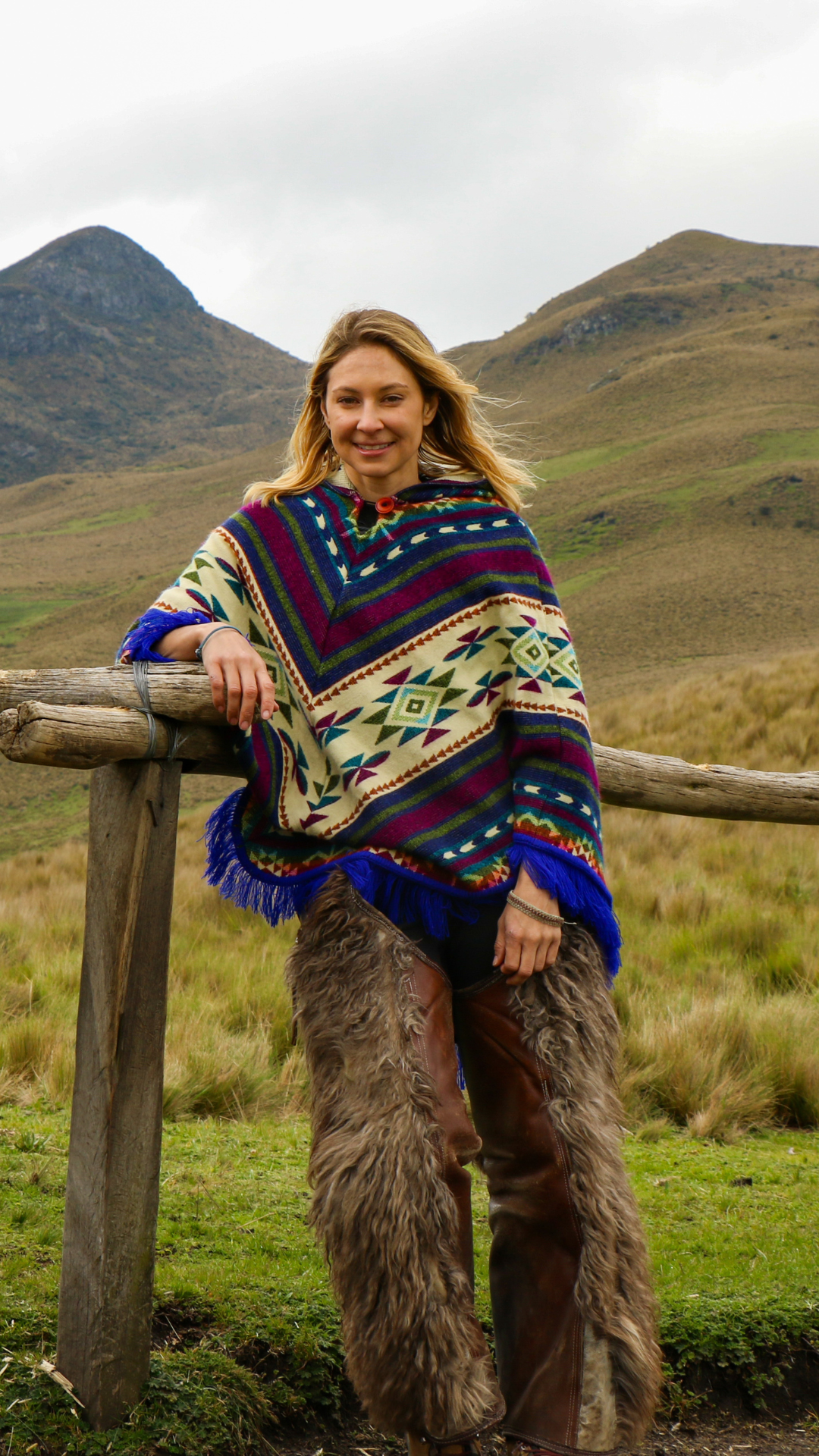 alice ford standing by a fence on a ranch.