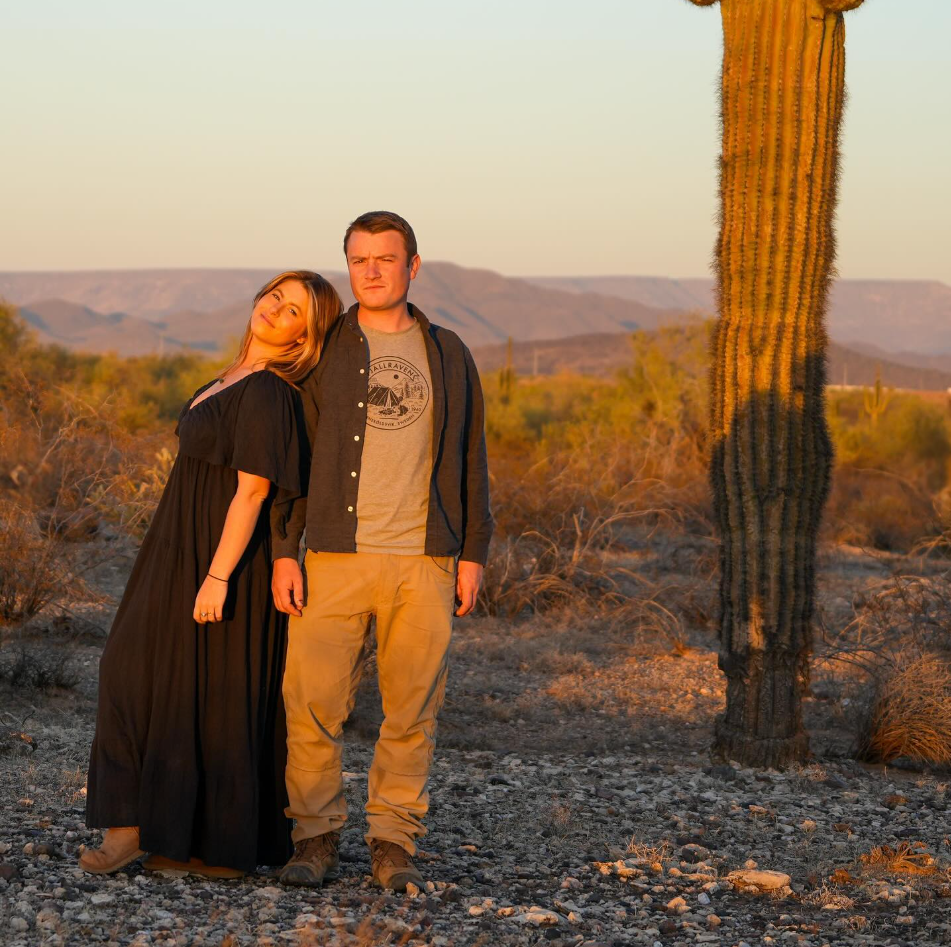 couple in the desert with beautiful sunlight